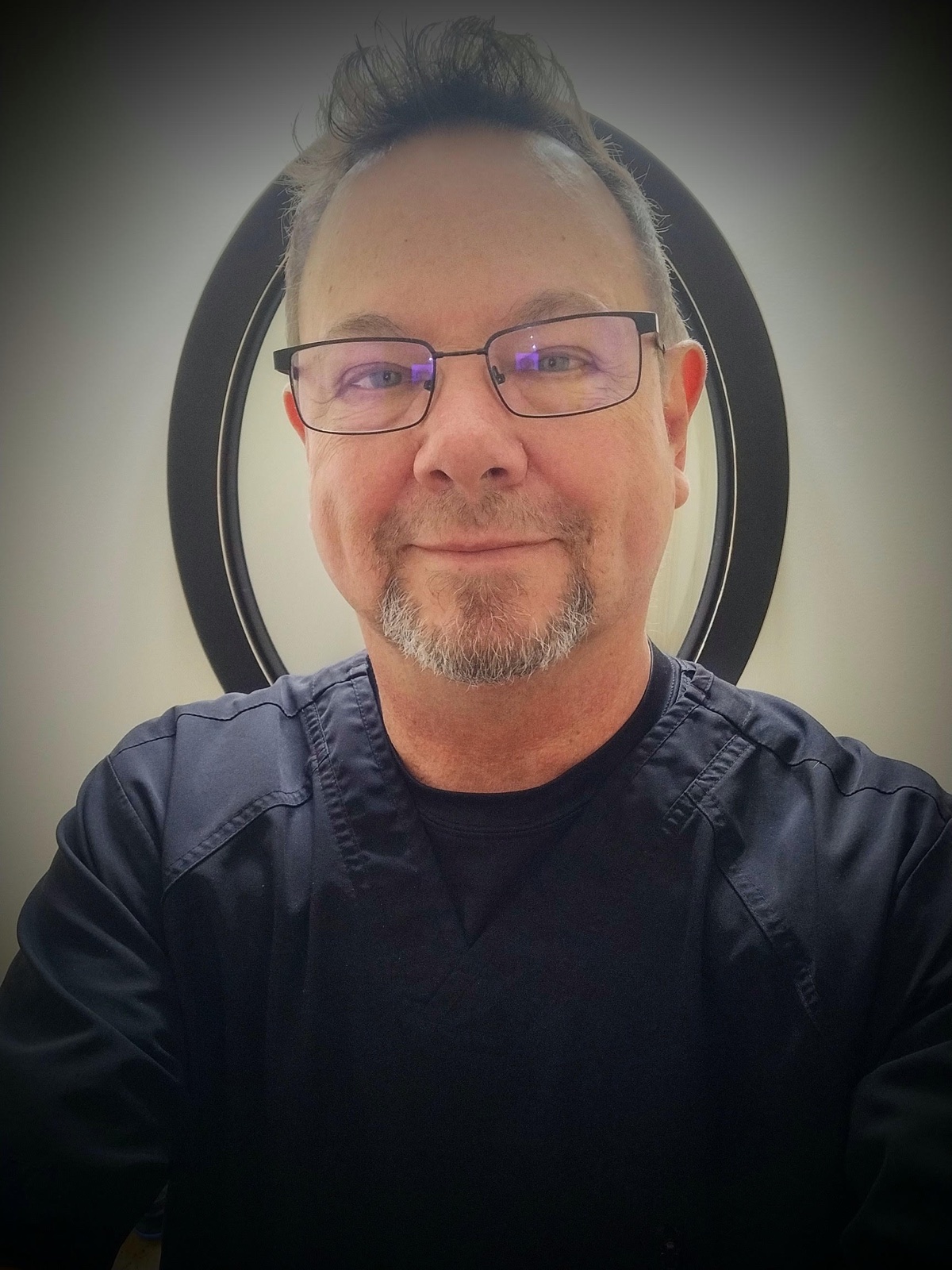 Kevin, a licensed massage therapist at ASAYA Massage and Wellness.